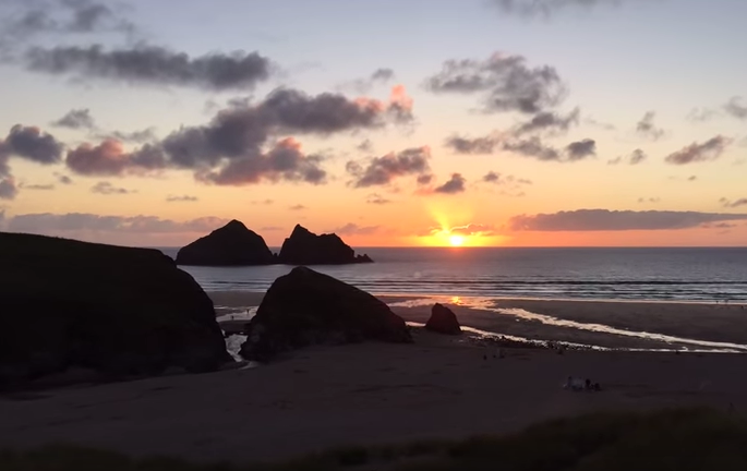 sunset time-lapse Holywell Bay beach, Newquay Cornwall