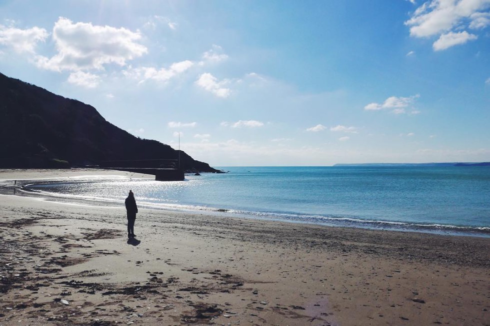 sunny morning on Polkerris Beach in south east cornwall