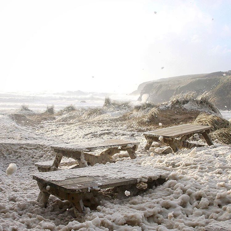 Foam on Poldhu beach cafe from storm Imogen - photo © poldhu beach cafe