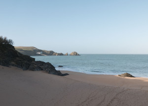 An empty Mother Iveys Bay beach looking towards the Padstow RNLI Lifeboat Station