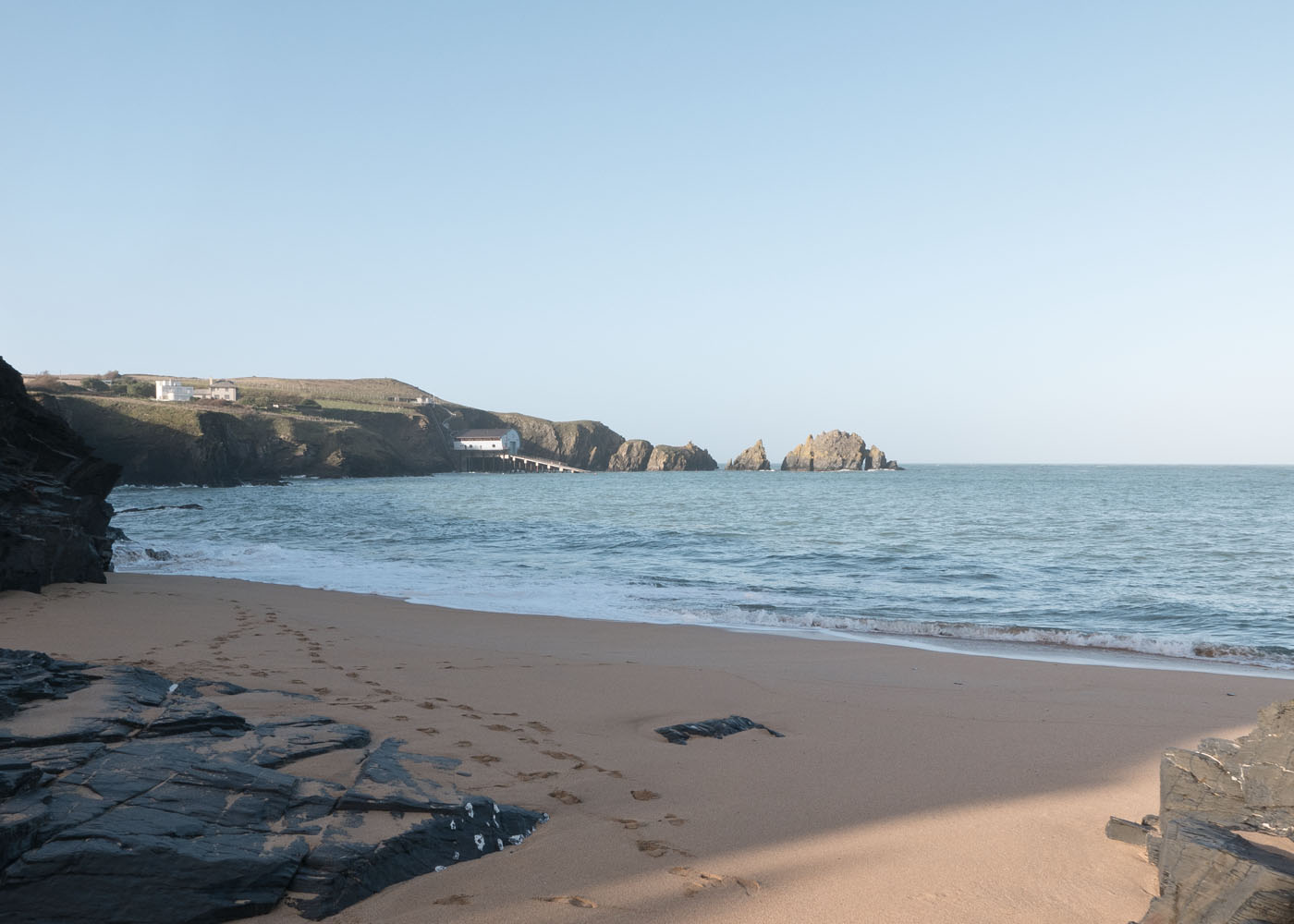 An empty Mother Iveys Bay beach looking towards the Padstow RNLI Lifeboat Station